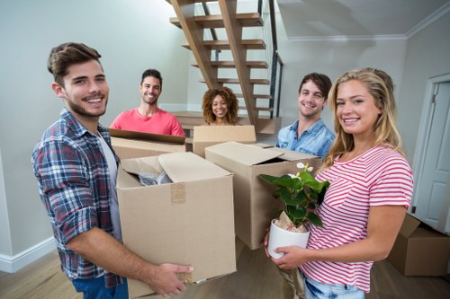 Small removals van loading furniture in Hounslow