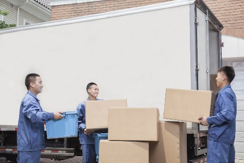 Professional movers handling furniture during a Hounslow removal