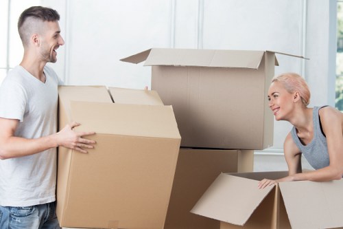 Employee checking safe handling procedures near stored items