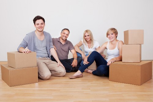 Packed moving boxes and furniture ready for transport in Hounslow